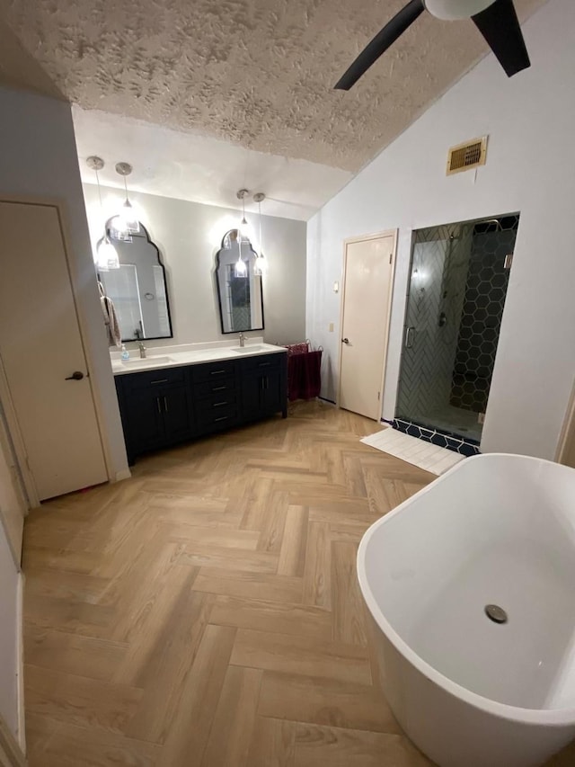 1903 Barons Gln, Sugar Land, TX 77478 - full bath featuring vaulted ceiling, a textured ceiling, a soaking tub, double vanity, and a shower stall
