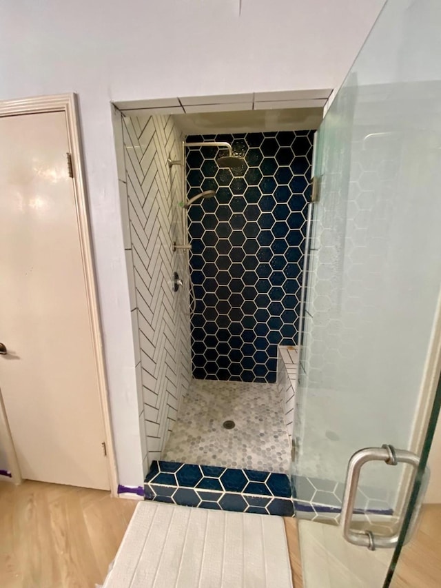 1903 Barons Gln, Sugar Land, TX 77478 - bathroom featuring a stall shower and wood finished floors