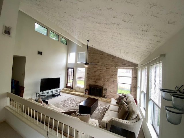 1903 Barons Gln, Sugar Land, TX 77478 - living area with a brick fireplace, high vaulted ceiling, a textured ceiling, and ceiling fan