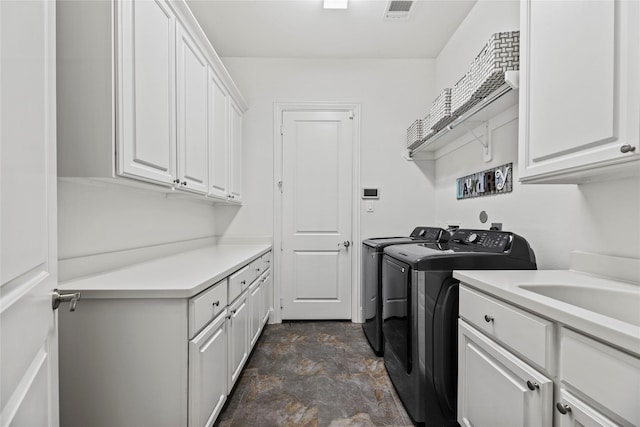 5518 Fleming Rock Ln, Fulshear, TX 77441 - clothes washing area with washer and clothes dryer, cabinet space, and stone finish flooring