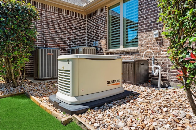 5518 Fleming Rock Ln, Fulshear, TX 77441 - exterior view of a power unit, central air condition unit, and brick siding