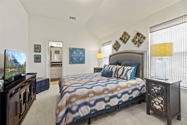 5518 Fleming Rock Ln, Fulshear, TX 77441 - bedroom with light carpet, vaulted ceiling, and connected bathroom