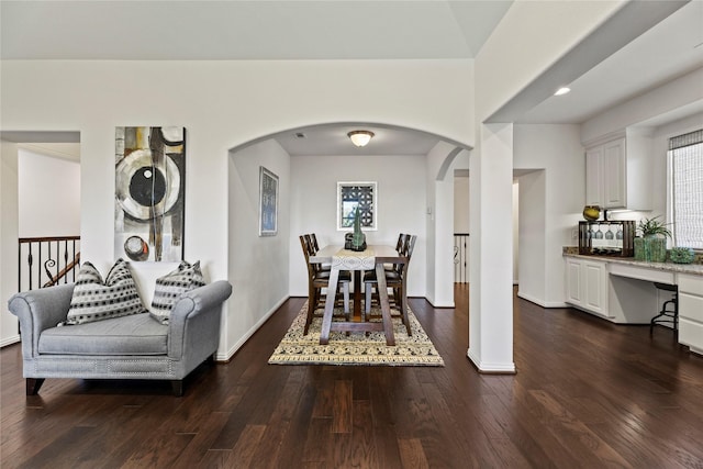 5518 Fleming Rock Ln, Fulshear, TX 77441 - dining space featuring arched walkways, dark wood-type flooring, baseboards, and recessed lighting