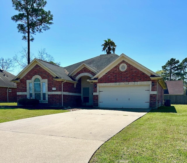 1207 S Diamondhead Blvd, Crosby, TX 77532 - view of front of property featuring a garage, brick siding, concrete driveway, and central AC
