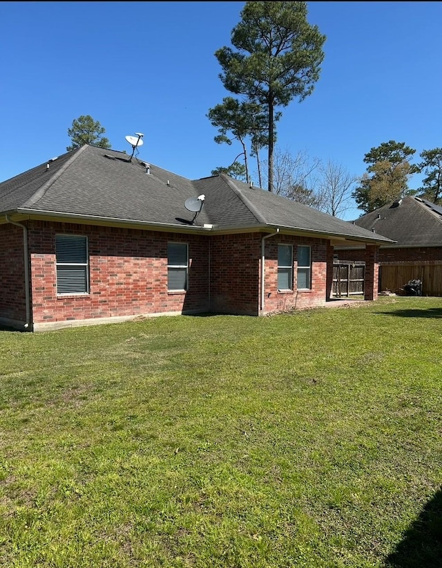 1207 S Diamondhead Blvd, Crosby, TX 77532 - rear view of house with brick siding and a shingled roof