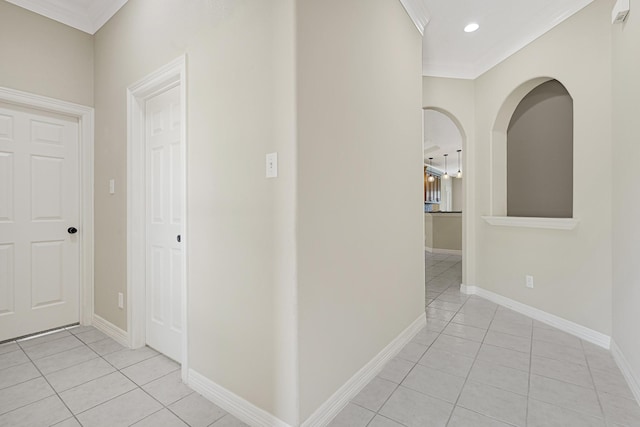 1207 S Diamondhead Blvd, Crosby, TX 77532 - hallway with light tile patterned floors, crown molding, recessed lighting, and baseboards