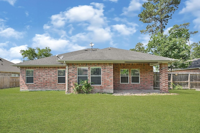 1207 S Diamondhead Blvd, Crosby, TX 77532 - rear view of house featuring brick siding, roof with shingles, and a patio