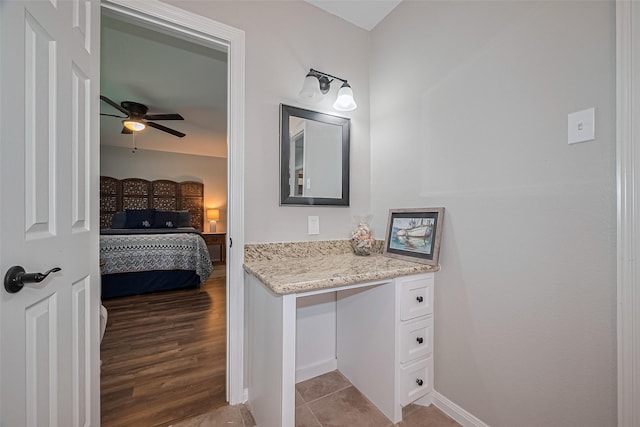 bathroom featuring a ceiling fan, baseboards, tile patterned floors, and vanity