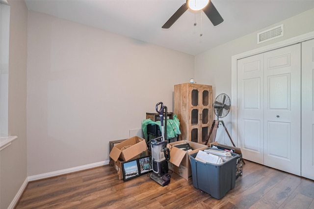 miscellaneous room featuring ceiling fan, wood finished floors, and baseboards