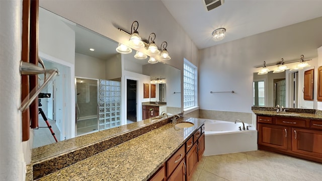 11111 Monte Rosa Ct, Richmond, TX 77406 - full bathroom with a stall shower, tile patterned flooring, a bath, two vanities, and a chandelier