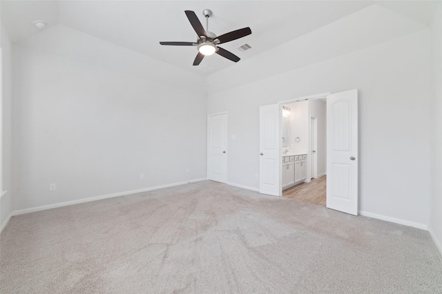 19806 Lone Paddock Cir, Tomball, TX 77377 - unfurnished bedroom featuring light carpet, baseboards, high vaulted ceiling, ensuite bathroom, and ceiling fan