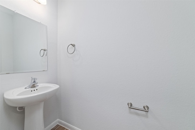 19806 Lone Paddock Cir, Tomball, TX 77377 - bathroom featuring baseboards and wood finished floors