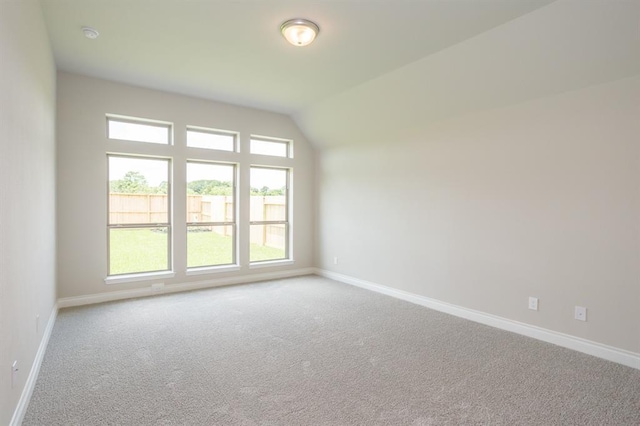 1639 Rosedale Dr, Missouri City, TX 77459 - empty room featuring baseboards, carpet, and lofted ceiling