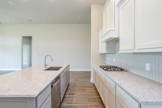 1639 Rosedale Dr, Missouri City, TX 77459 - kitchen featuring a sink, stainless steel appliances, dark wood finished floors, baseboards, and tasteful backsplash