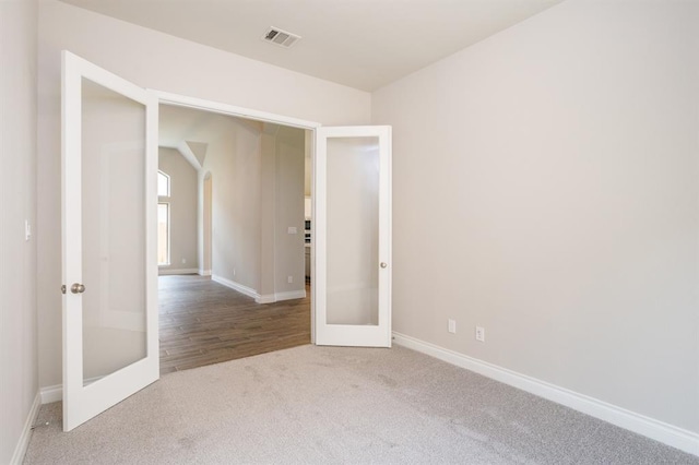 1639 Rosedale Dr, Missouri City, TX 77459 - carpeted spare room featuring french doors and baseboards