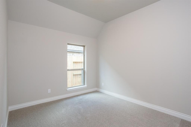1639 Rosedale Dr, Missouri City, TX 77459 - empty room with carpet floors, baseboards, and vaulted ceiling