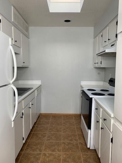 kitchen featuring electric range oven, freestanding refrigerator, under cabinet range hood, light countertops, and white cabinetry
