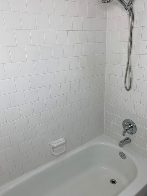 bathroom featuring washtub / shower combination
