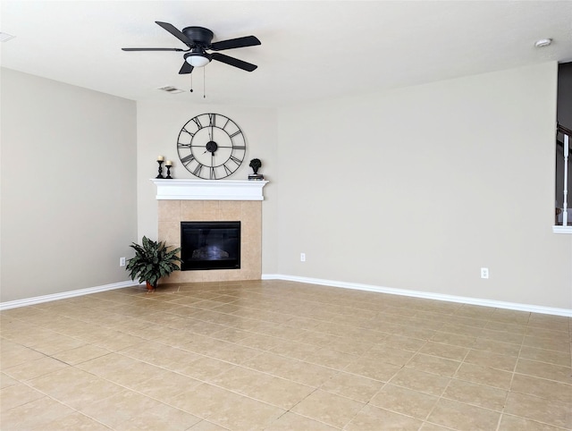 10718 Wall Fern Way, Houston, TX 77034 - unfurnished living room with a tile fireplace, a ceiling fan, baseboards, and light tile patterned floors
