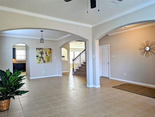 10718 Wall Fern Way, Houston, TX 77034 - empty room featuring light tile patterned flooring, a ceiling fan, ornamental molding, baseboards, and stairs