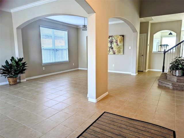 10718 Wall Fern Way, Houston, TX 77034 - entryway featuring light tile patterned floors, ornamental molding, baseboards, and stairs