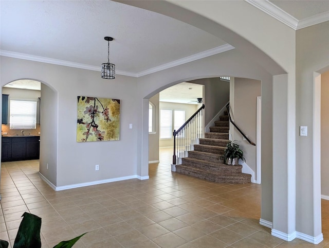 10718 Wall Fern Way, Houston, TX 77034 - unfurnished dining area with light tile patterned floors, healthy amount of natural light, ornamental molding, and stairway