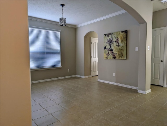 10718 Wall Fern Way, Houston, TX 77034 - unfurnished room featuring tile patterned flooring, ornamental molding, a textured ceiling, arched walkways, and baseboards