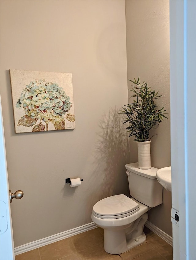 10718 Wall Fern Way, Houston, TX 77034 - bathroom with toilet, baseboards, and tile patterned floors