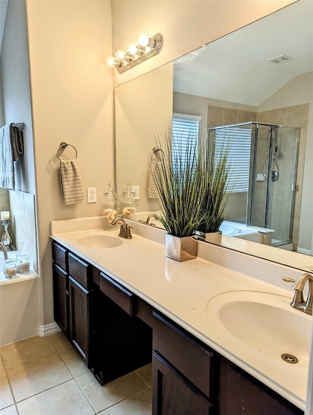 10718 Wall Fern Way, Houston, TX 77034 - bathroom featuring a shower stall, tile patterned flooring, double vanity, a bath, and vaulted ceiling