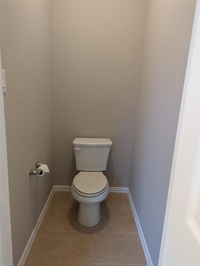 10718 Wall Fern Way, Houston, TX 77034 - bathroom featuring toilet, tile patterned floors, and baseboards