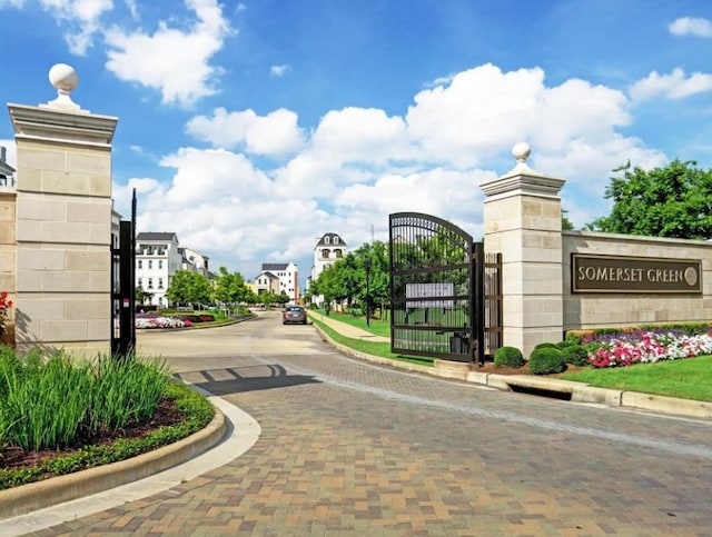 3507 Eaton Estates Ln, Houston, TX 77055 - view of decorative road with curbs, a gate, and street lights
