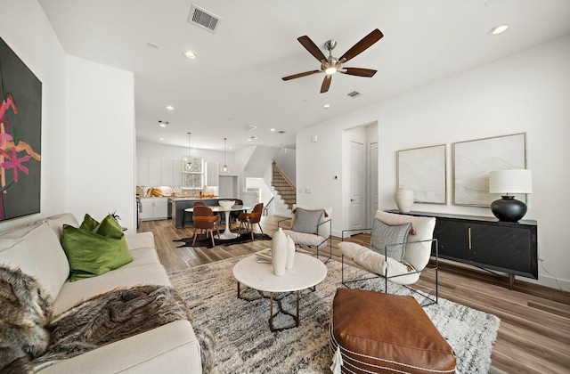 3507 Eaton Estates Ln, Houston, TX 77055 - living area with stairs, wood finished floors, ceiling fan, recessed lighting, and baseboards