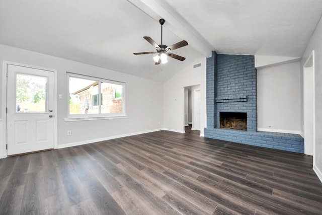 unfurnished living room featuring a ceiling fan, dark wood-type flooring, a brick fireplace, and baseboards