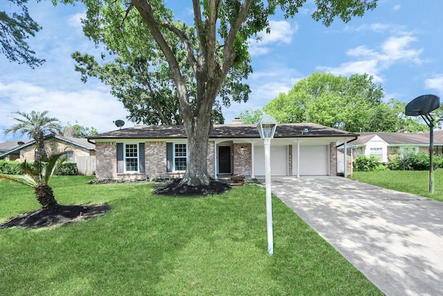 single story home with a garage, a front yard, driveway, and brick siding
