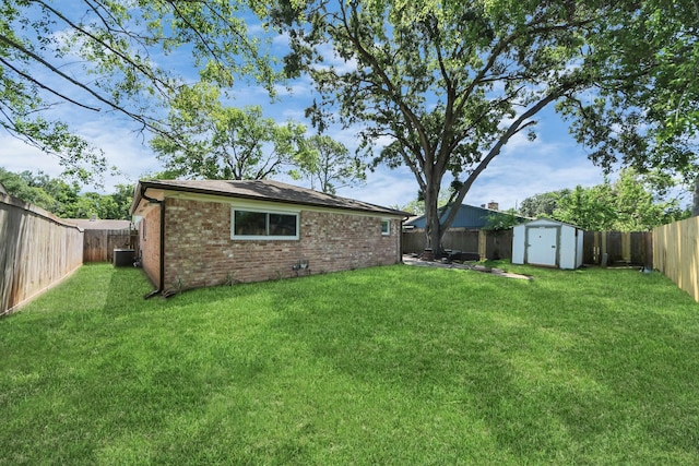 view of yard featuring a storage shed, an outdoor structure, and central air condition unit