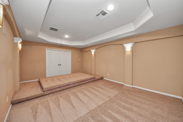 finished below grade area featuring crown molding, carpet flooring, recessed lighting, and baseboards