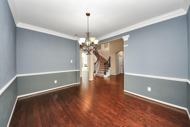 unfurnished room with arched walkways, wood-type flooring, ornamental molding, stairway, and baseboards