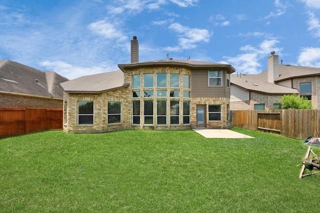 back of house with a patio and a chimney