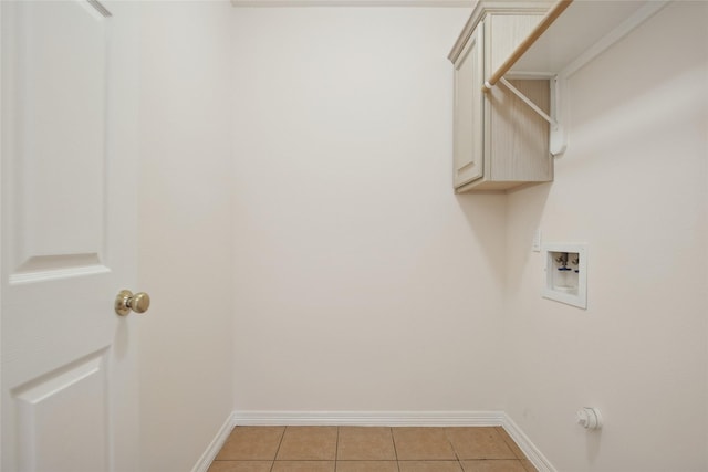 18415 Deer Crossing Dr, Humble, TX 77346 - clothes washing area featuring washer hookup, light tile patterned flooring, cabinet space, and baseboards