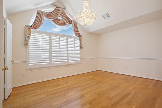 18415 Deer Crossing Dr, Humble, TX 77346 - unfurnished room with a chandelier, wood finished floors, and baseboards