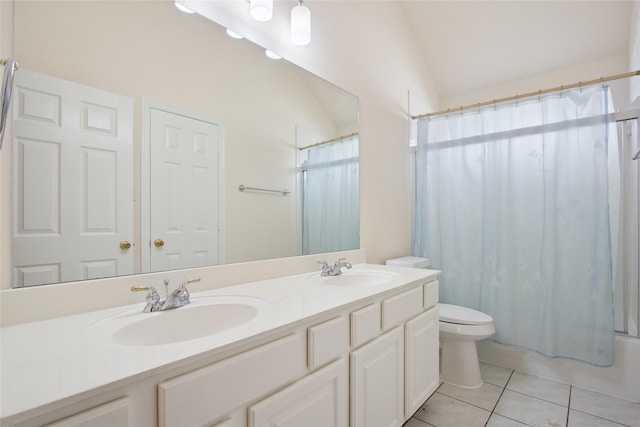 18415 Deer Crossing Dr, Humble, TX 77346 - bathroom featuring tile patterned floors, toilet, double vanity, lofted ceiling, and shower / bath combo with shower curtain