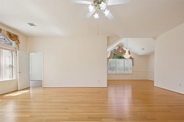 18415 Deer Crossing Dr, Humble, TX 77346 - unfurnished living room featuring light wood-style flooring, a ceiling fan, baseboards, and lofted ceiling