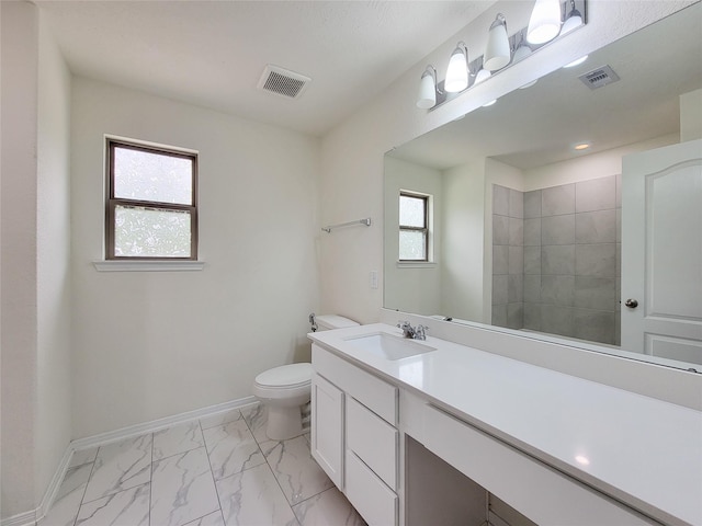 4015 Mossy Banks Ln, Houston, TX 77068 - bathroom featuring toilet, marble look tile flooring, vanity, and baseboards