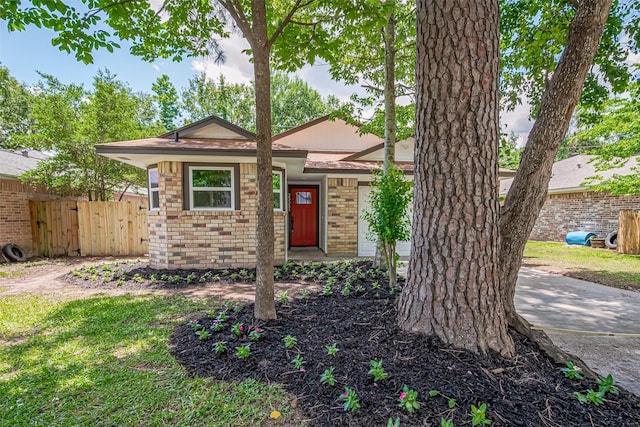 23331 Balthasar St, Spring, TX 77373 - view of front of property featuring brick siding and fence