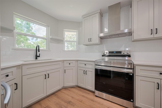 23331 Balthasar St, Spring, TX 77373 - kitchen with wall chimney exhaust hood, electric stove, a sink, tasteful backsplash, and open shelves