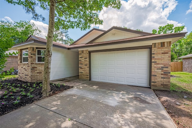 23331 Balthasar St, Spring, TX 77373 - ranch-style home with brick siding, driveway, a garage, and fence