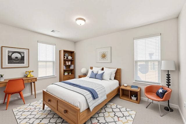 3011 Tandem Ct, Rosenberg, TX 77471 - bedroom with light colored carpet, multiple windows, and baseboards