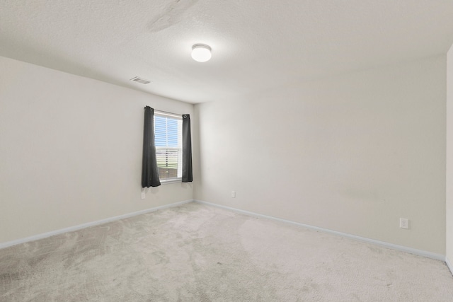 3011 Tandem Ct, Rosenberg, TX 77471 - spare room with light carpet, baseboards, and a textured ceiling