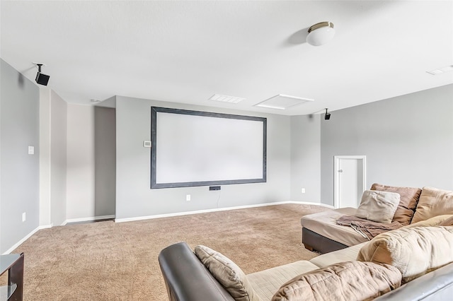 carpeted cinema room with baseboards