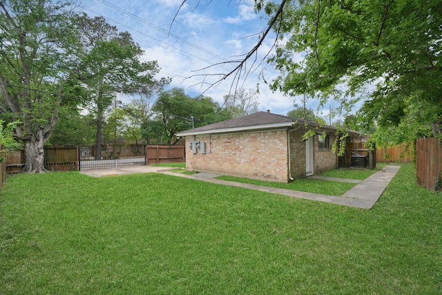 view of yard featuring a patio and central AC unit